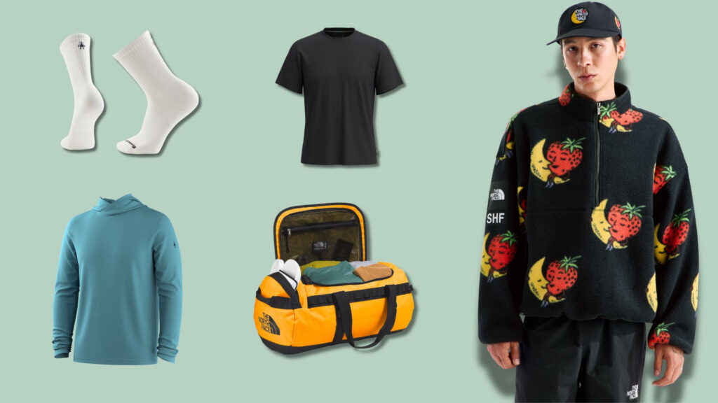 Collage of outdoor apparel on a mint background: white socks, a black T‑shirt, a teal hoodie, an orange duffel bag with gear, and a model wearing a strawberry‑print fleece jacket with a cap.