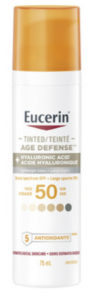 Eucerin Tinted Age Defense sunscreen with SPF 50; white bottle with orange cap and hyaluronic acid label